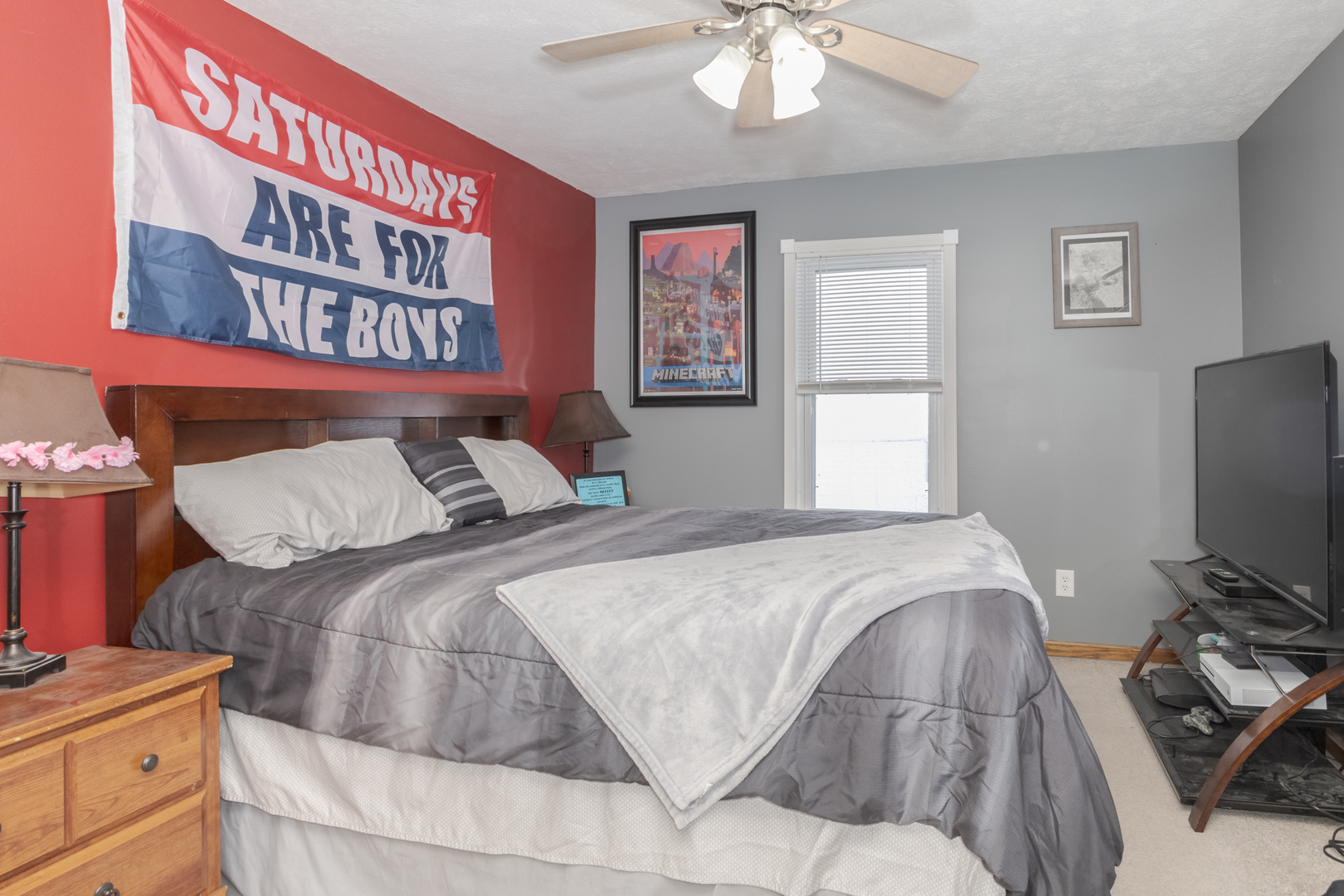 9948 North 100 E Road Gridley, IL 61744 - Photo 17 of 27 a bedroom with a bed and a flat screen tv