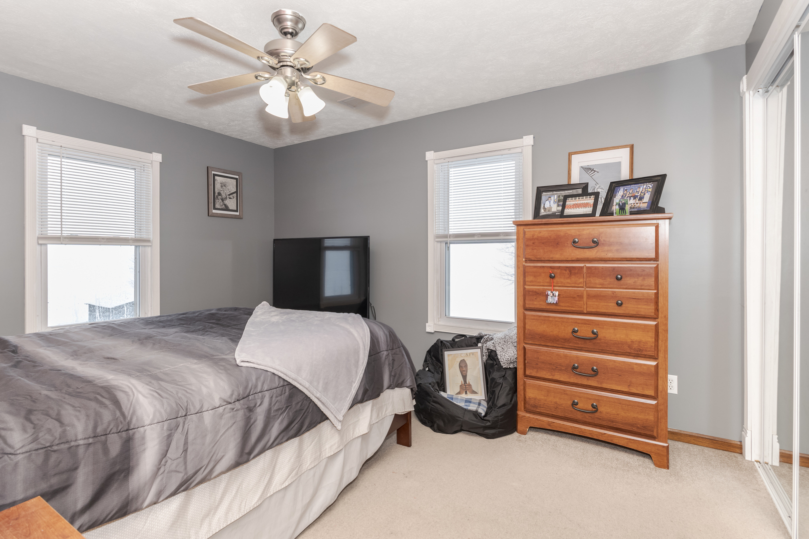 9948 North 100 E Road Gridley, IL 61744 - Photo 18 of 27 a bedroom with a bed and a chandelier