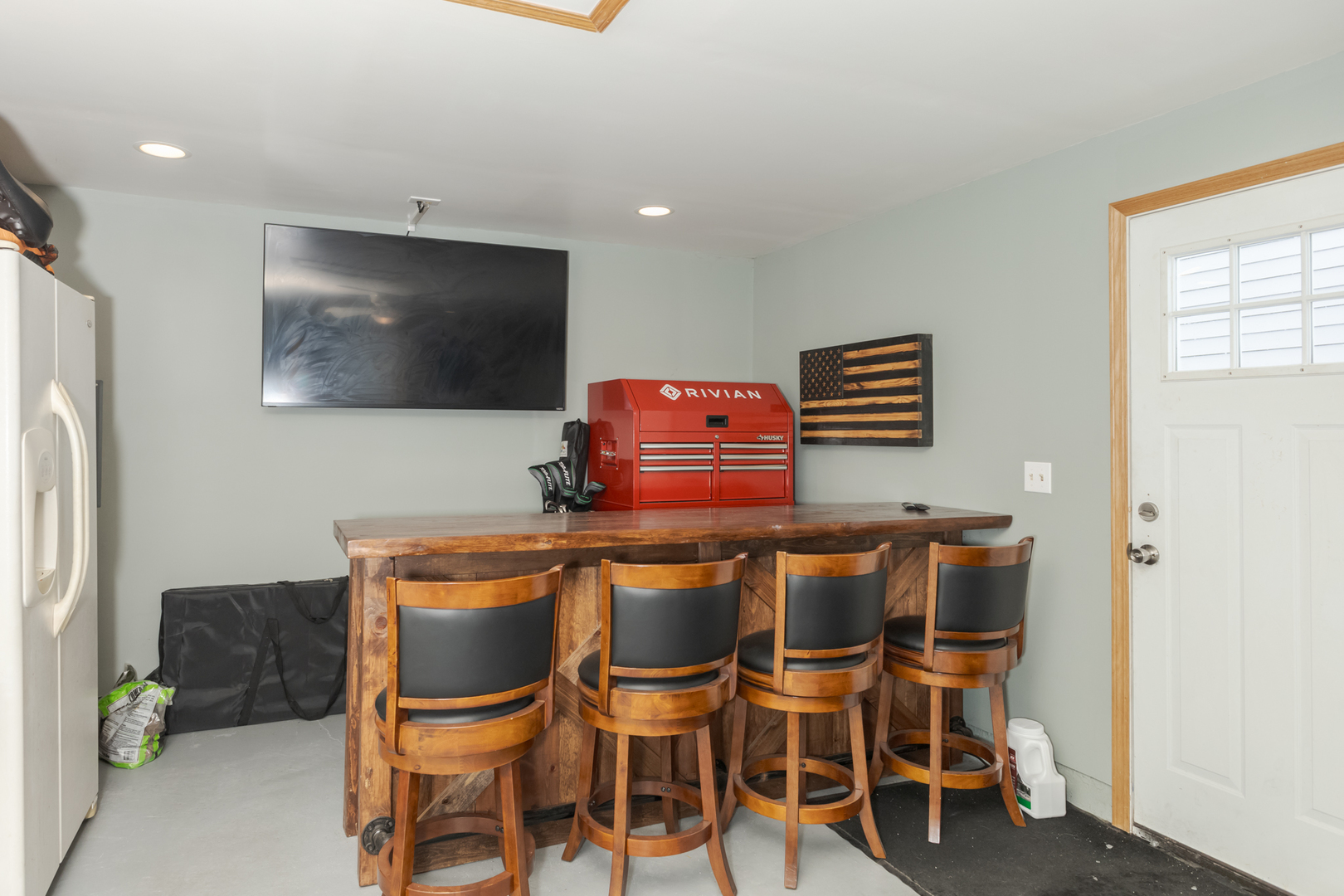 9948 North 100 E Road Gridley, IL 61744 - Photo 22 of 27 a dining room with furniture and a flat screen tv