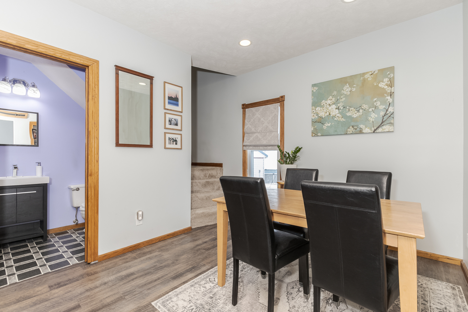 9948 North 100 E Road Gridley, IL 61744 - Photo 5 of 27 a view of a dining room with furniture and wooden floor