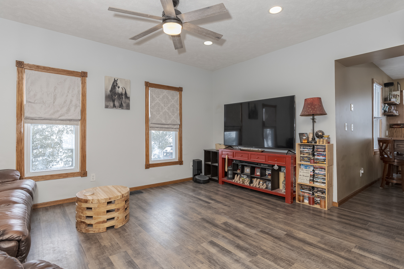 9948 North 100 E Road Gridley, IL 61744 - Photo 7 of 27 a living room with furniture and a flat screen tv