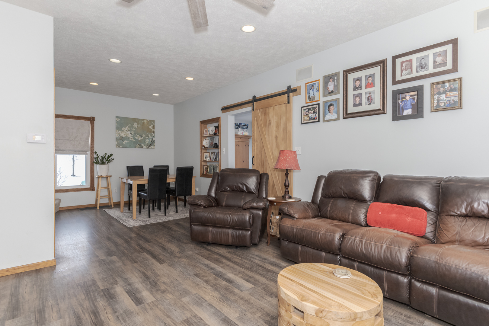 9948 North 100 E Road Gridley, IL 61744 - Photo 9 of 27 a living room with furniture and paintings on the wall