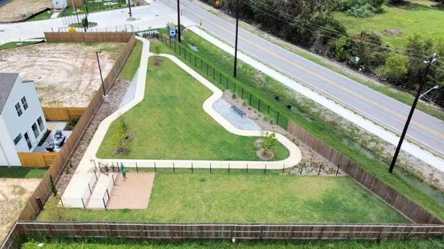 a view of a swimming pool with a yard