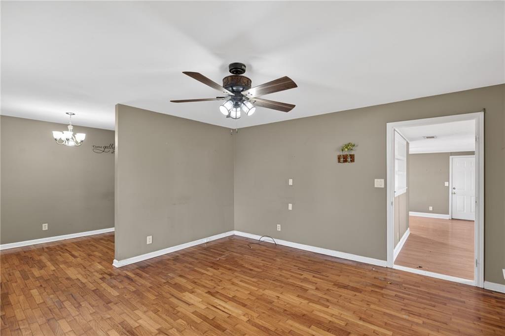 113 Maple Street Bremen, GA 30110 - Photo 12 of 23 a view of an empty room with wooden floor
