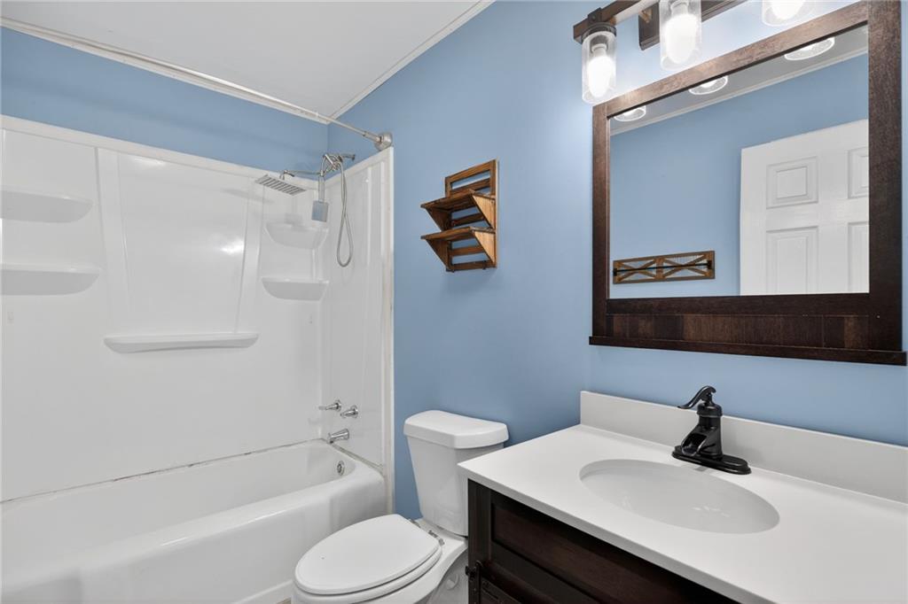 113 Maple Street Bremen, GA 30110 - Photo 14 of 23 a bathroom with a sink toilet and shower