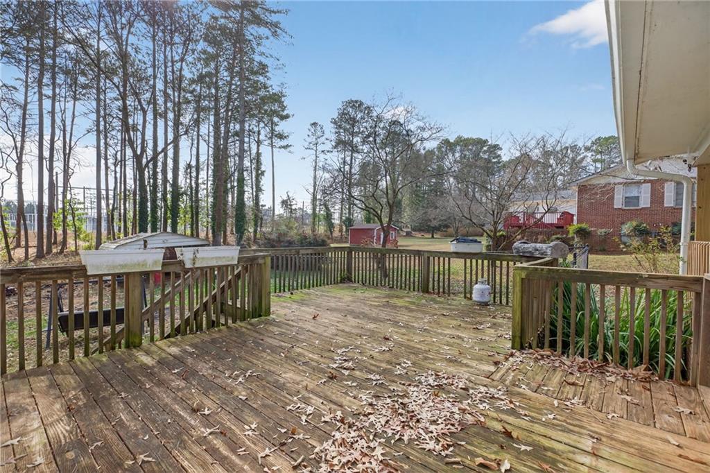 113 Maple Street Bremen, GA 30110 - Photo 17 of 23 a view of a lake with a bench next to a lake
