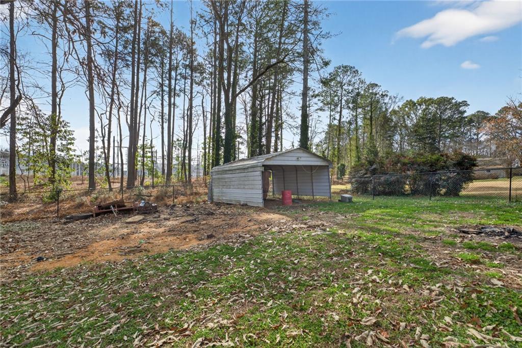 113 Maple Street Bremen, GA 30110 - Photo 22 of 23 a view of a house with a yard and tree s