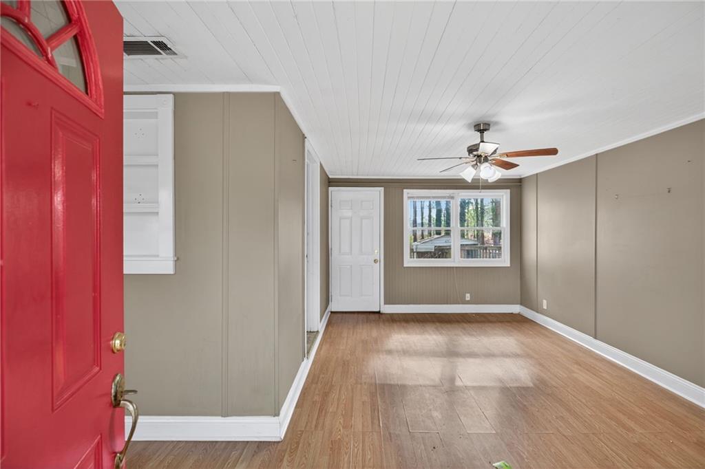 113 Maple Street Bremen, GA 30110 - Photo 3 of 23 a view of an empty room with glass door and windows