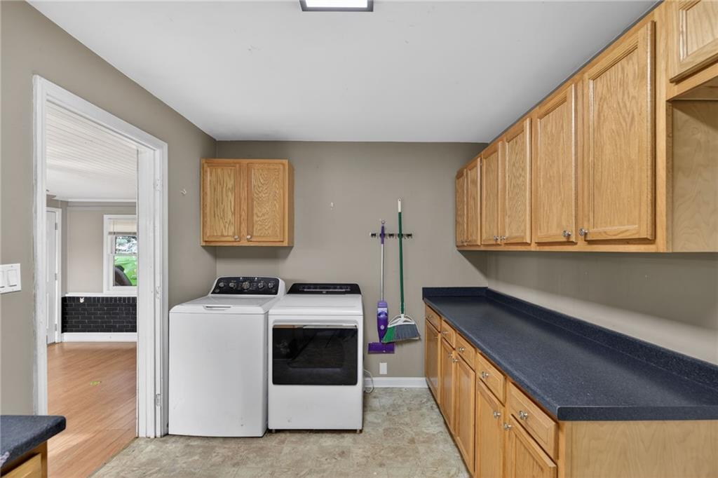 113 Maple Street Bremen, GA 30110 - Photo 9 of 23 a kitchen with stainless steel appliances granite countertop a stove a sink and a microwave