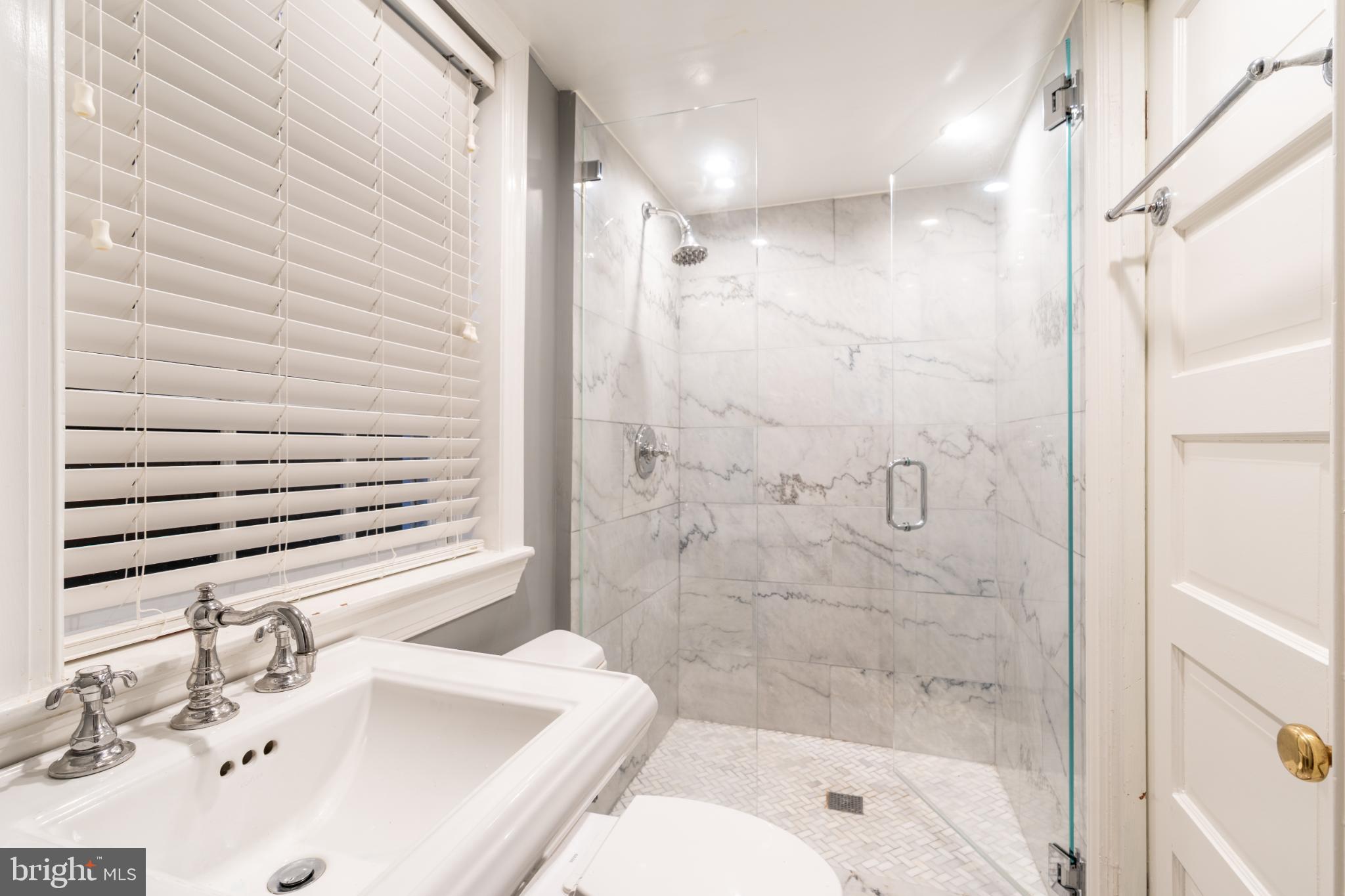 4920 Palisade Lane Northwest Washington, DC 20016 - Photo 54 of 70 Lower level marble bathroom with modern fixtures