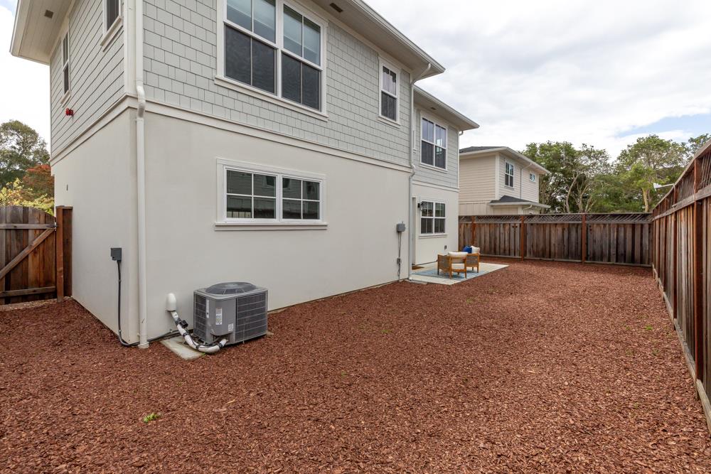 103 Staggi Lane Soquel, CA 95073 - Photo 28 of 35 a backyard of a house with table and chairs