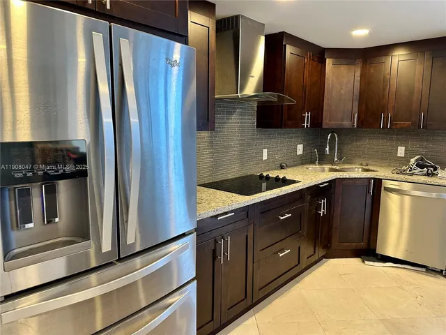 a view of a kitchen with a sink and cabinets