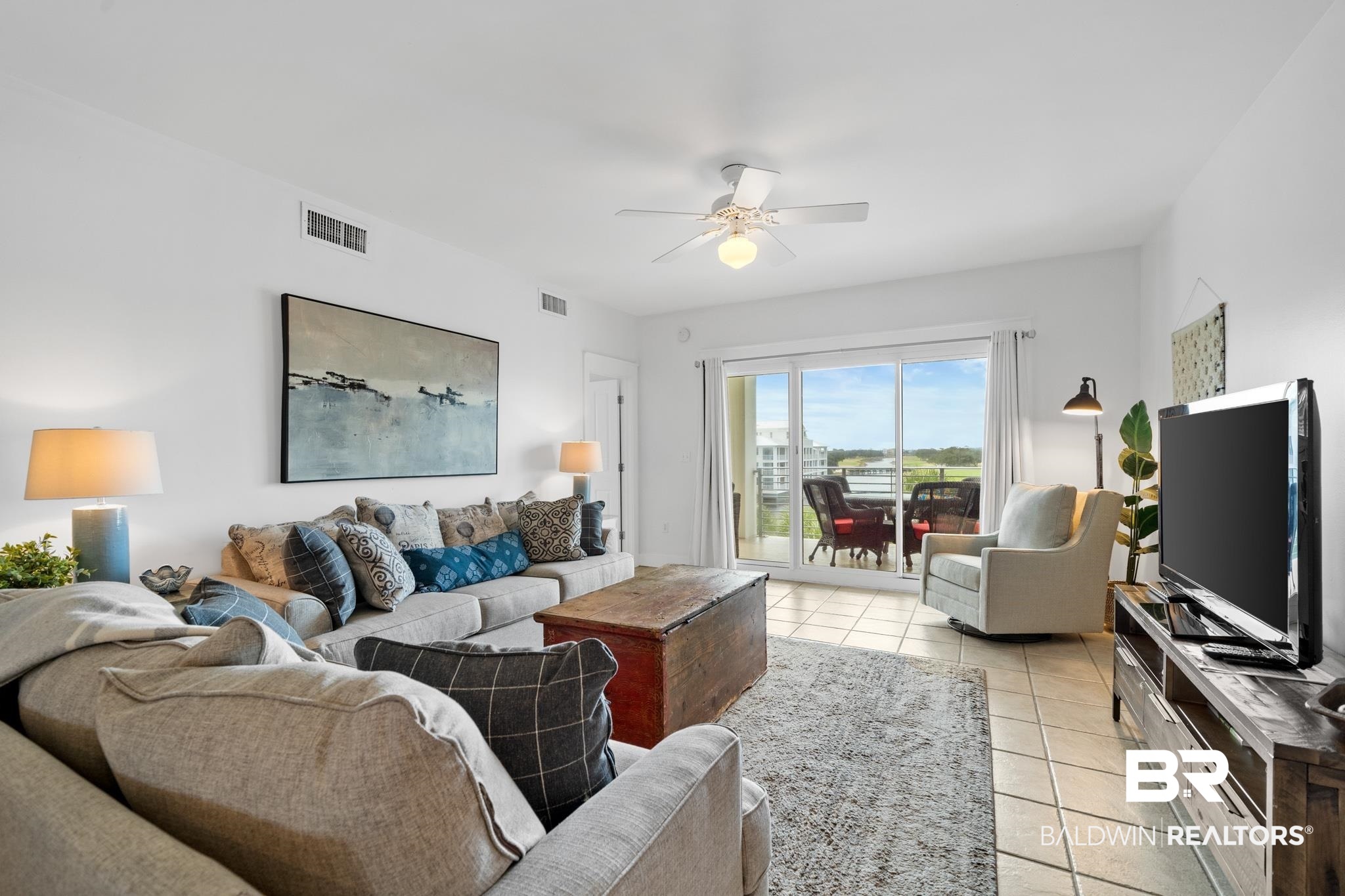 815 Plantation Road, Unit 301 Gulf Shores, AL 36542 - Photo 5 of 29 Living area with visible vents, ceiling fan, and light tile patterned floors