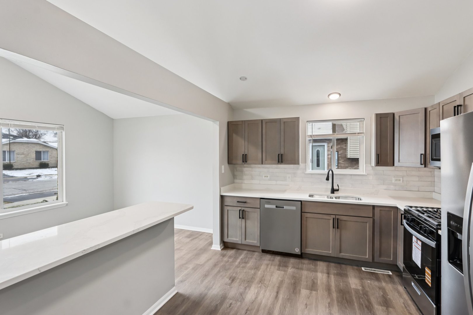 3348 Willow Lane Markham, IL 60428 - Photo 13 of 41 a kitchen with a sink stove and cabinets