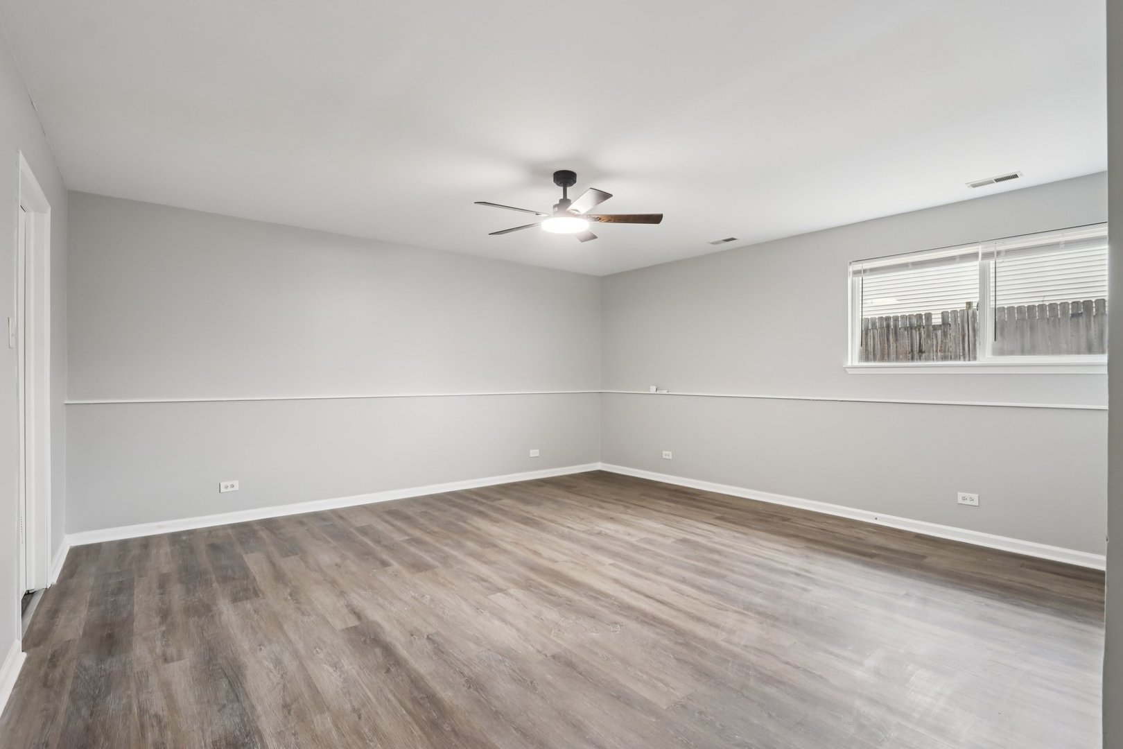 3348 Willow Lane Markham, IL 60428 - Photo 16 of 41 wooden floor in an empty room with a window