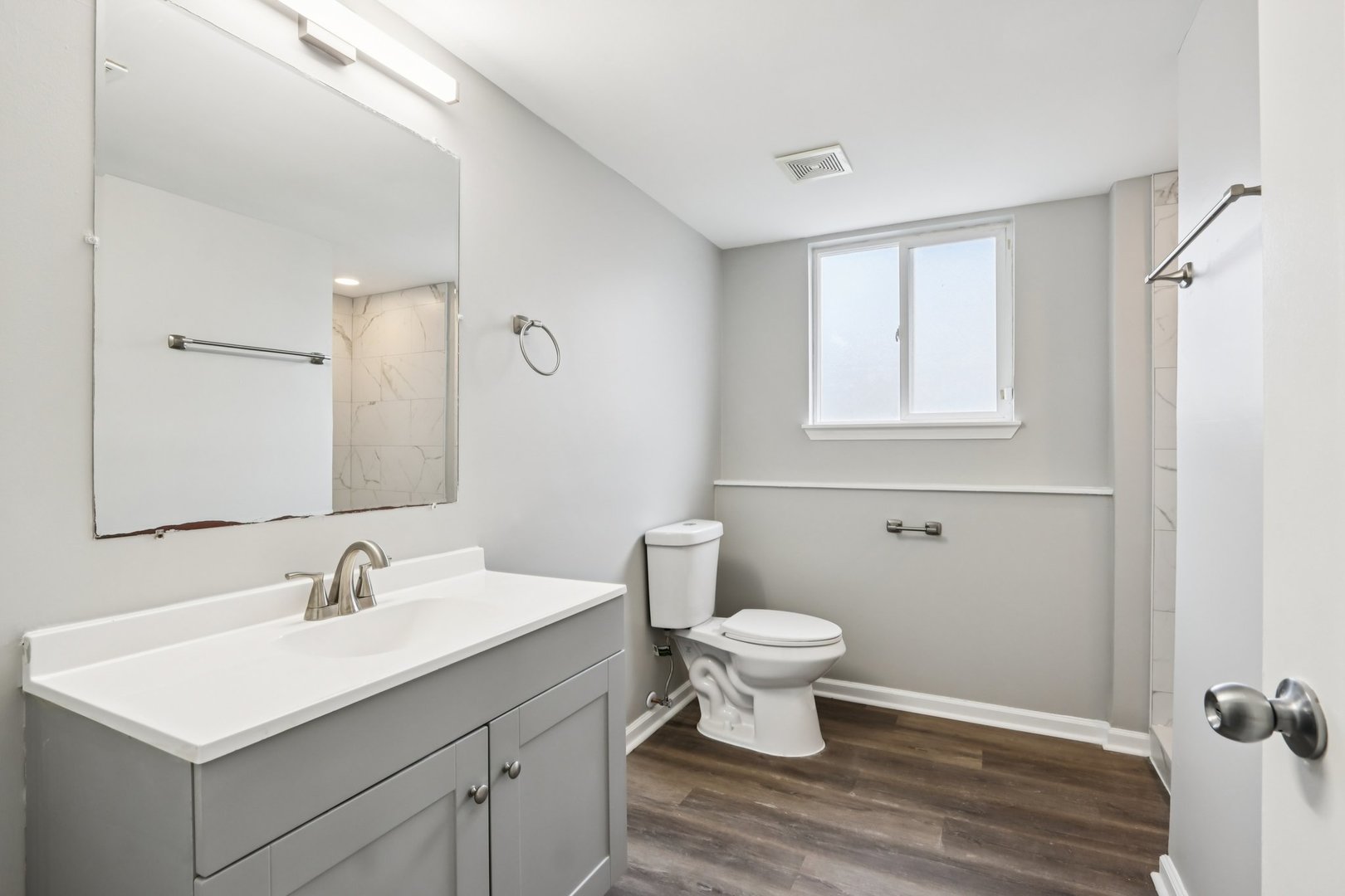 3348 Willow Lane Markham, IL 60428 - Photo 17 of 41 a bathroom with a sink toilet a mirror and vanity