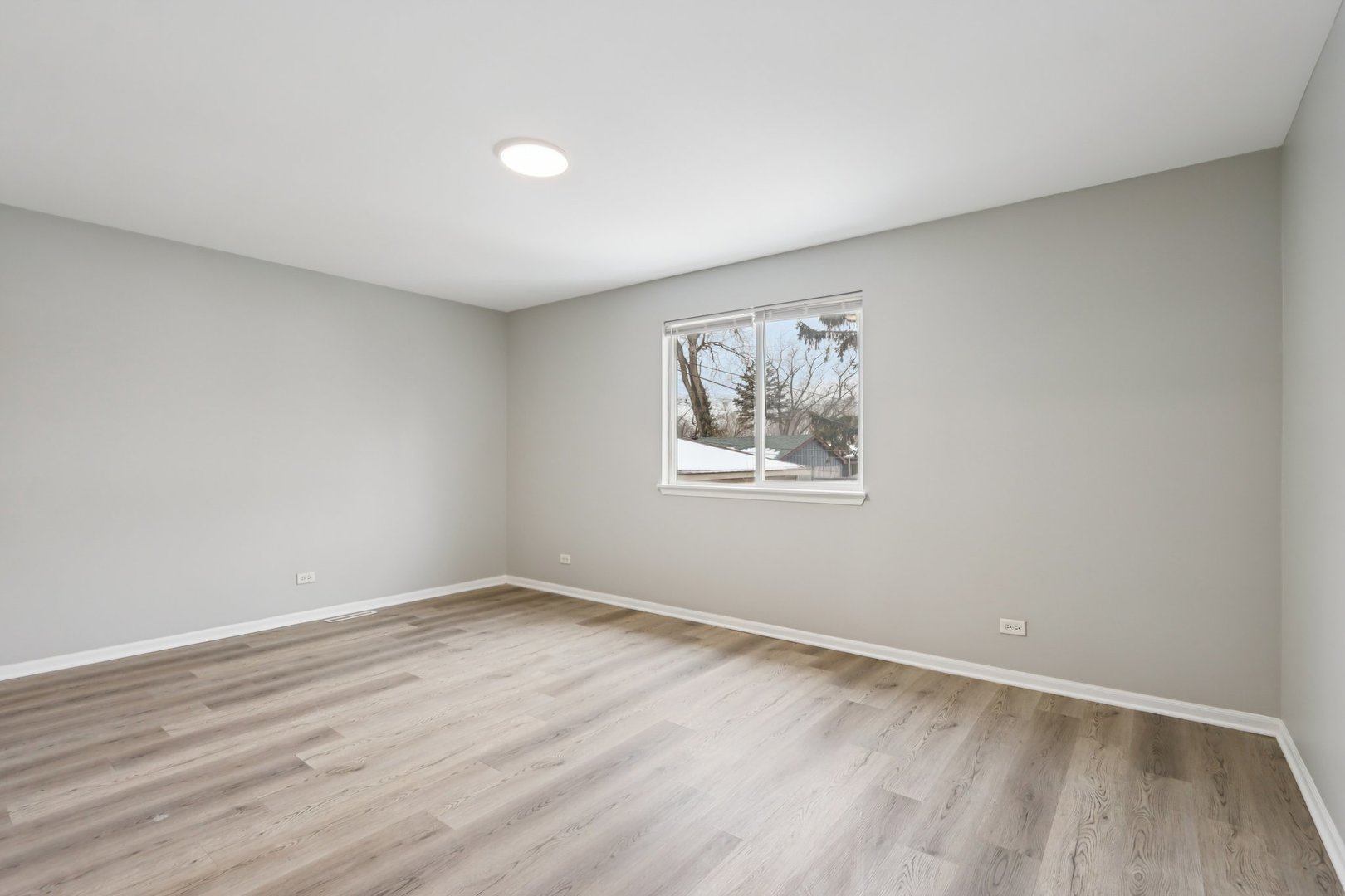 3348 Willow Lane Markham, IL 60428 - Photo 30 of 41 wooden floor in an empty room with a window