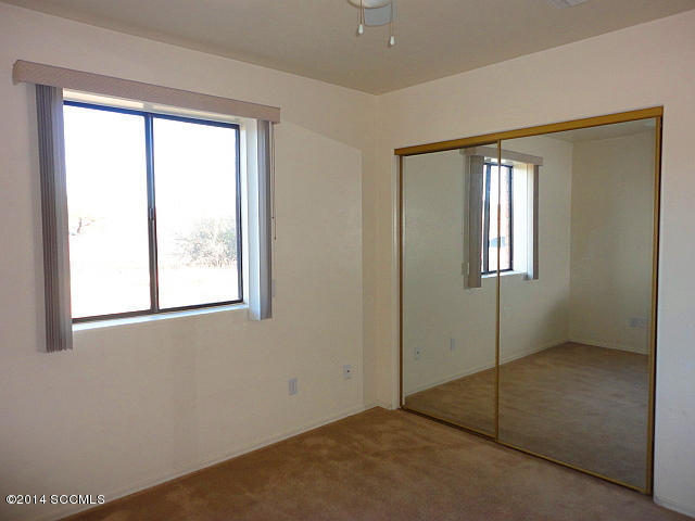 1688 Chapel Court Rio Rico, AZ 85648 - Photo 8 of 10 an empty room with windows