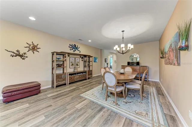 a kitchen with stainless steel appliances kitchen island granite countertop a refrigerator and a sink