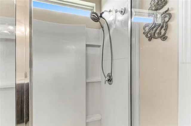 a view of a room with gym equipment and a large window