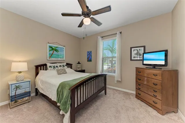 a view of a room with gym equipment and floor to ceiling window