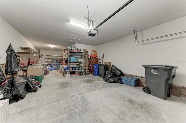 an aerial view of residential house with outdoor space and lake view