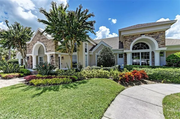an aerial view of a house with a yard