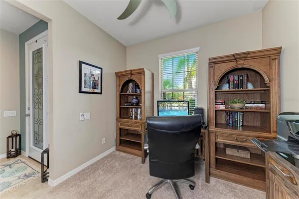 a dining room with furniture and window