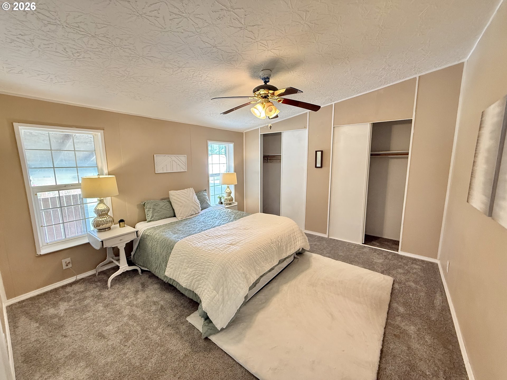 1282 3rd Street, Unit 37 Lafayette, OR 97127 - Photo 9 of 28 a bedroom with a bed dresser and a window