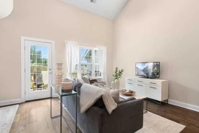 a living room with furniture and a flat screen tv