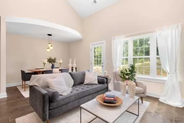 a living room with furniture and a large window