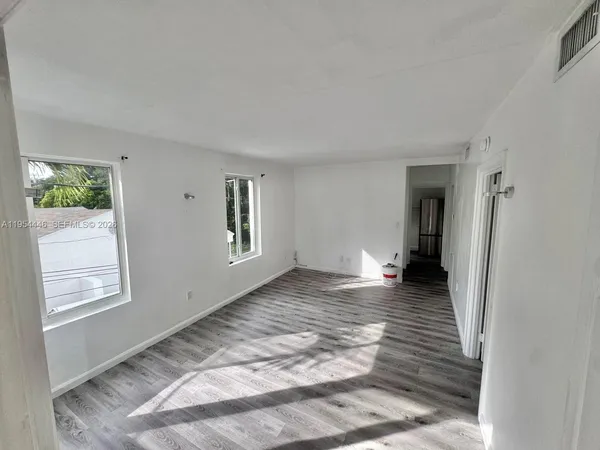 a view of an empty room and window