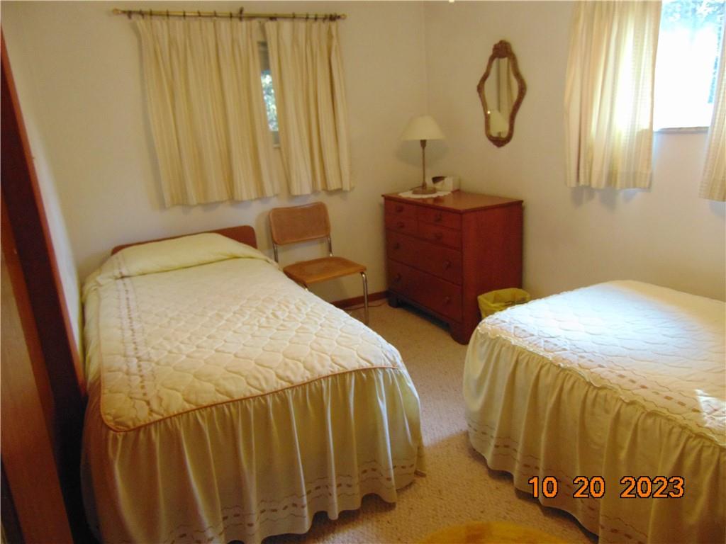 168 Bottom Road Mill Run, PA 15464 - Photo 20 of 26 a bedroom with two beds and chandelier