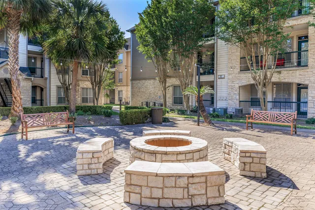 a front view of a house with sitting area