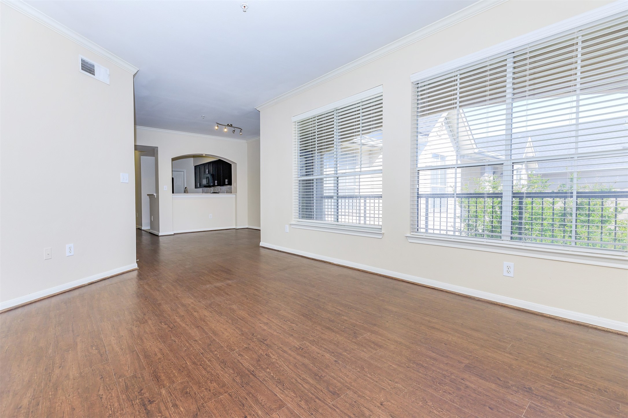5510 South Rice Avenue, Unit 428 Houston, TX 77081 - Photo 6 of 6 wooden floor in an empty room with a window