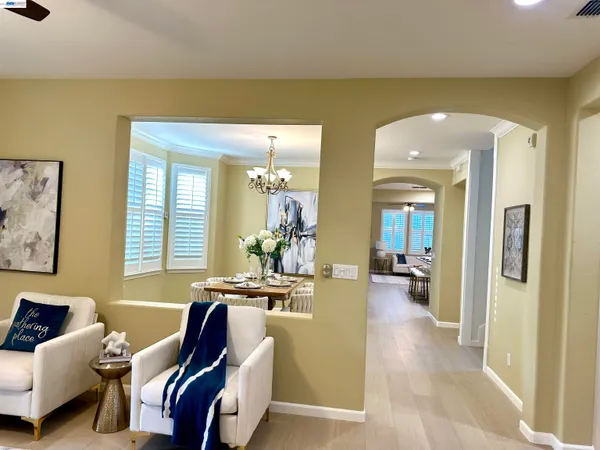 a view of a livingroom with furniture and windows