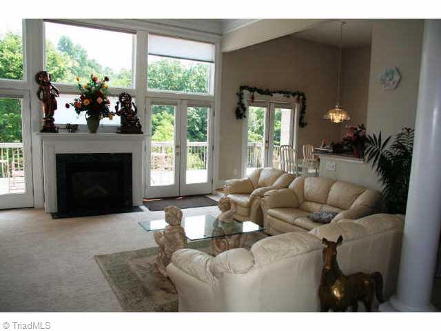 2601 Burch Point High Point, NC 27265 - Photo 2 of 9 Other. Open living room with vaulted ceilings and large windows.
