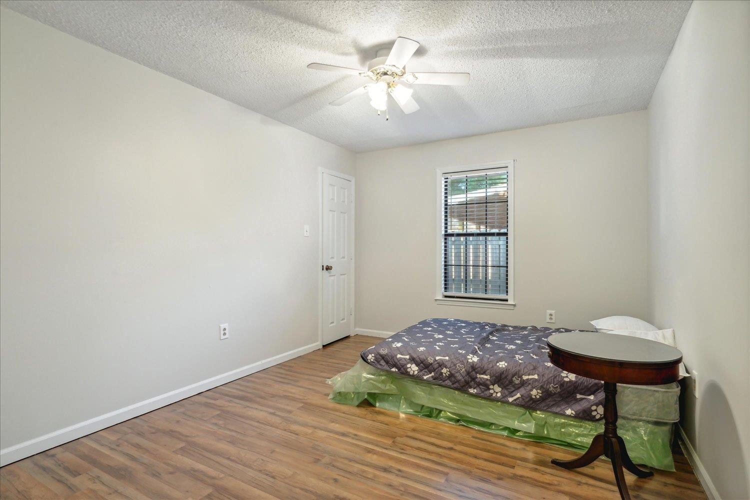 4419 Logan's Path Road Millington, TN 38053 - Photo 12 of 21 a view of a room with a wooden floor and a chandelier fan