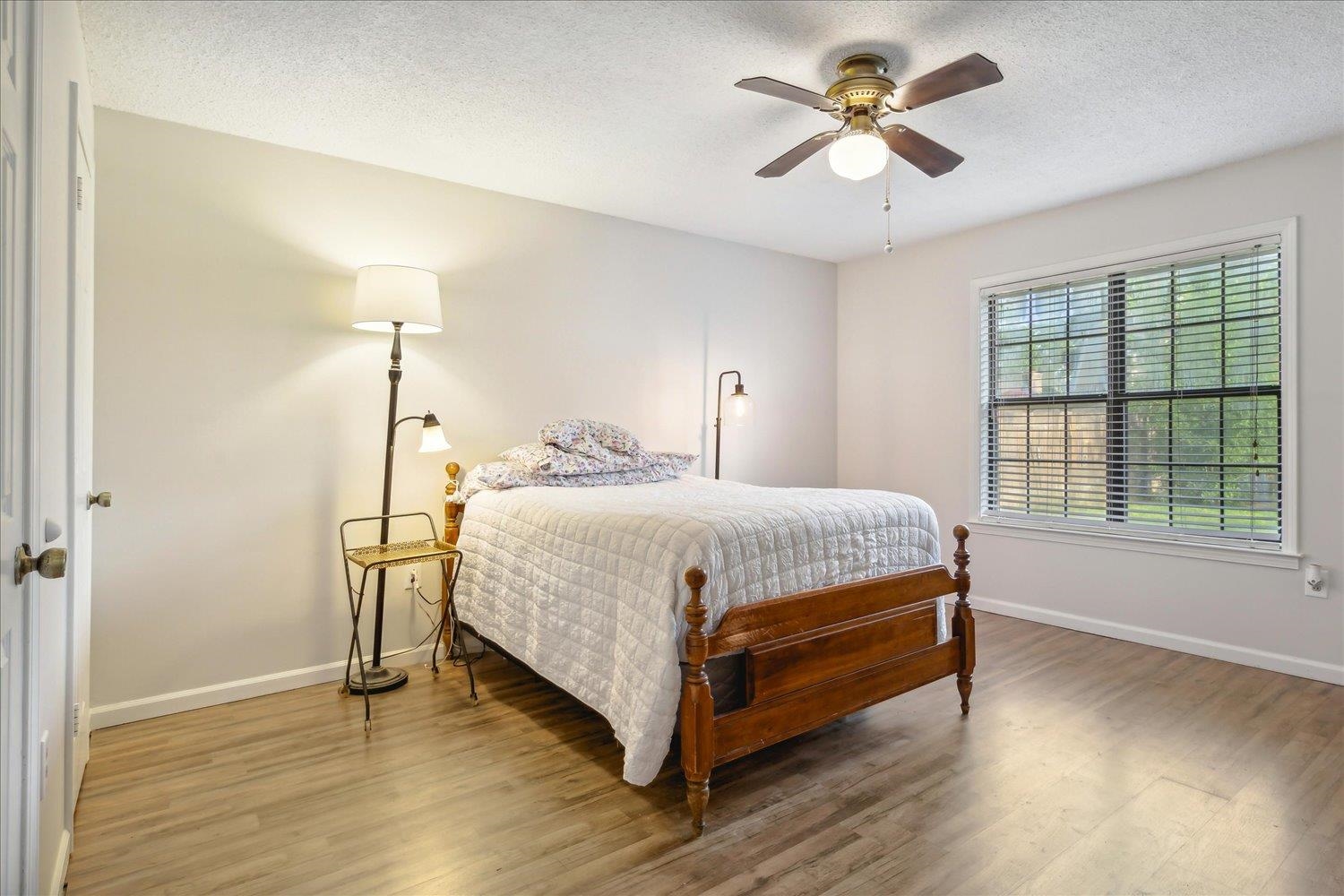 4419 Logan's Path Road Millington, TN 38053 - Photo 14 of 21 a bedroom with a bed and a chandelier