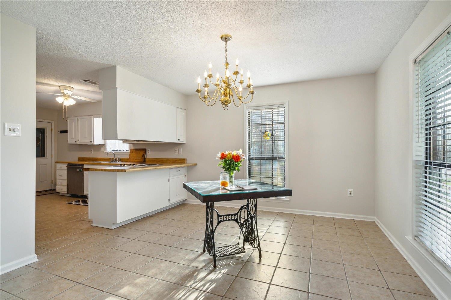 4419 Logan's Path Road Millington, TN 38053 - Photo 20 of 21 a kitchen with stainless steel appliances kitchen island granite countertop a sink and a white cabinets