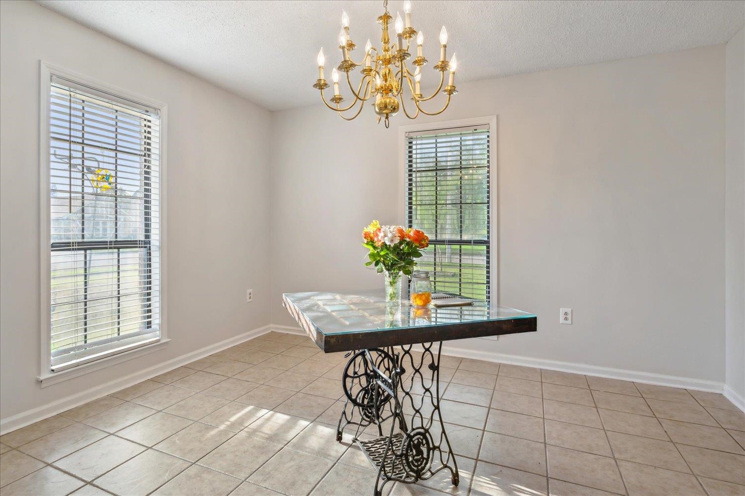 4419 Logan's Path Road Millington, TN 38053 - Photo 21 of 21 a view of a dining room with furniture and chandelier