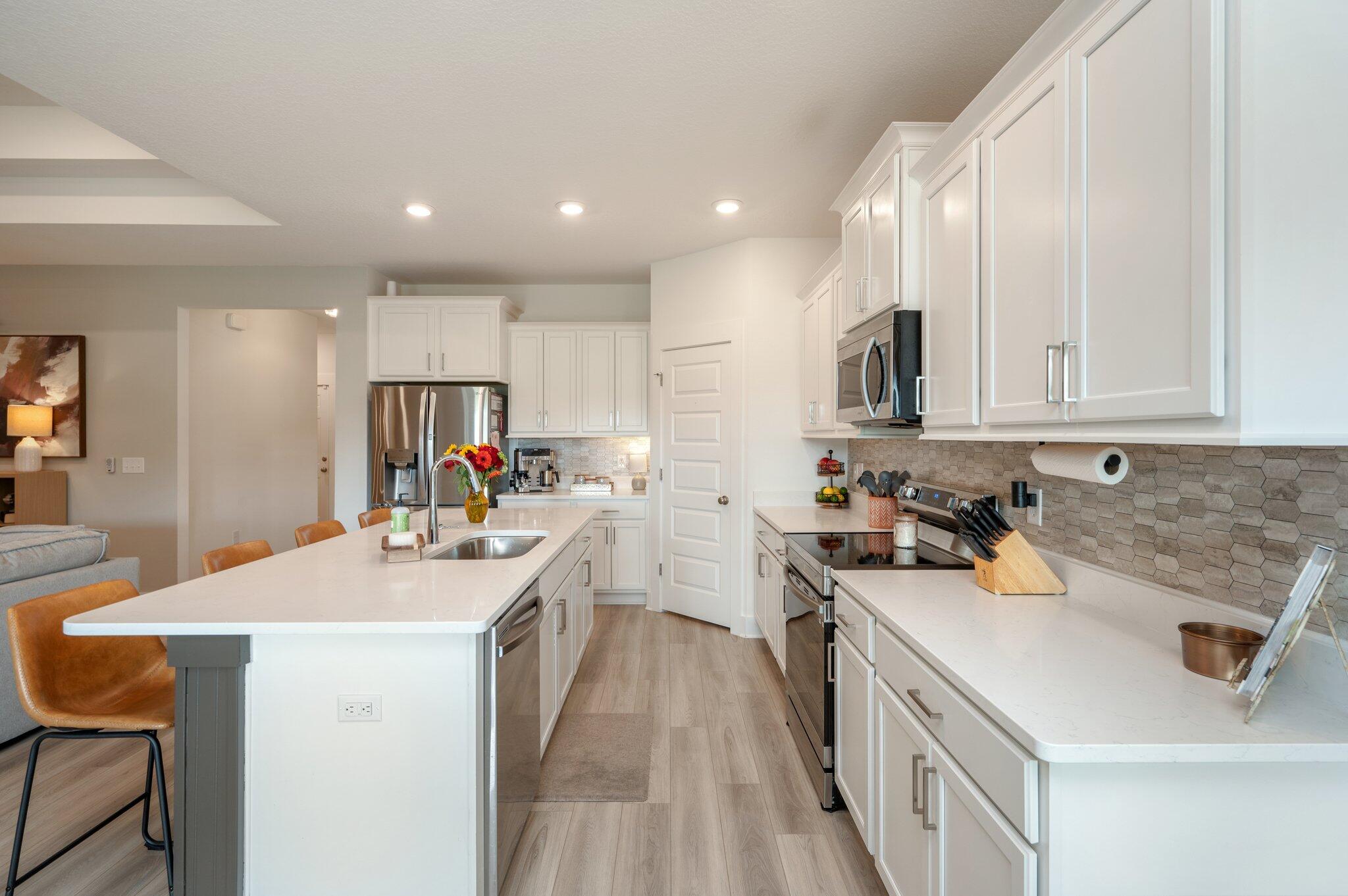 134 Blooming Cove Crestview, FL 32539 - Photo 12 of 50 a kitchen with a sink stove and cabinets
