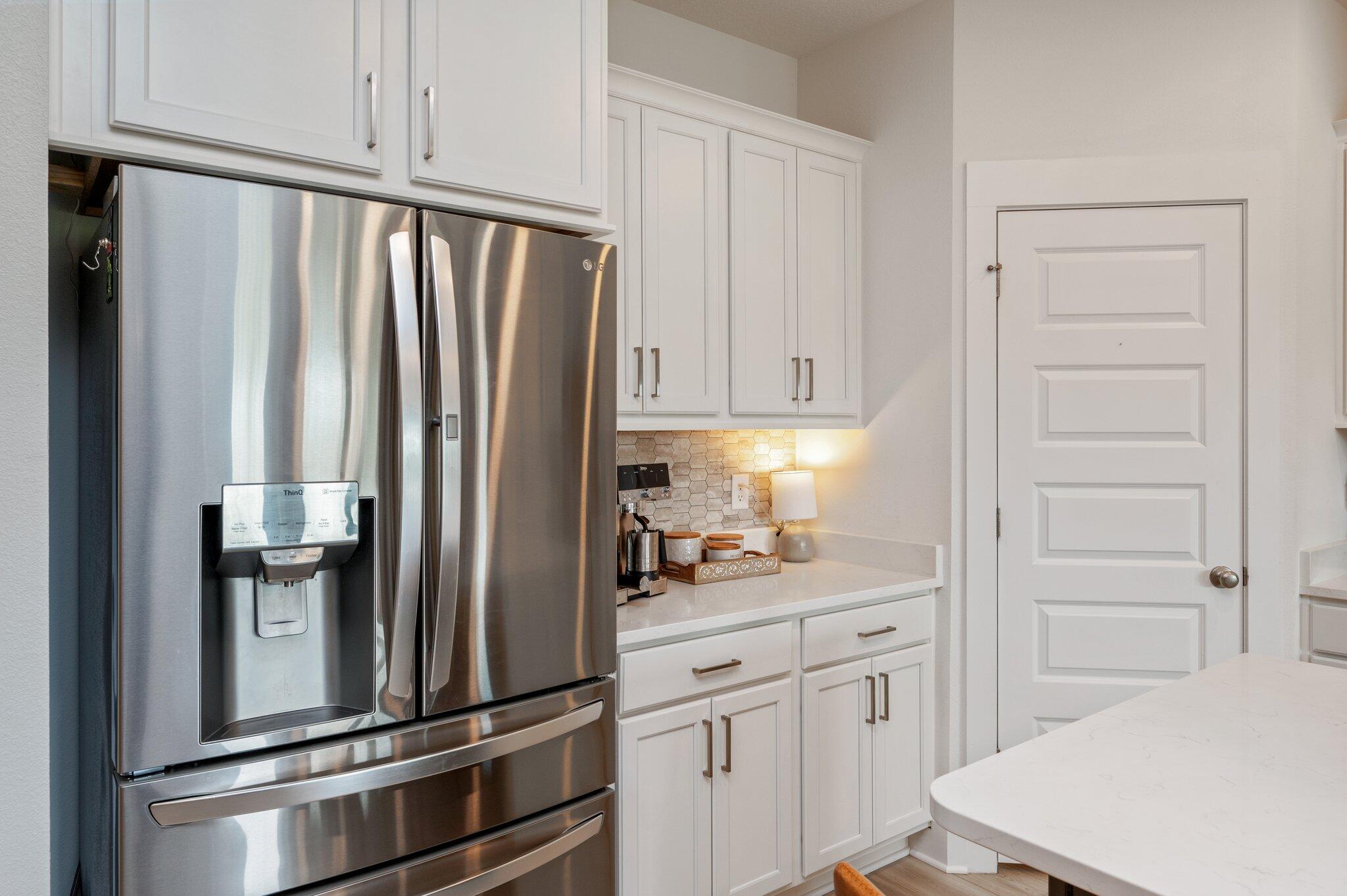 134 Blooming Cove Crestview, FL 32539 - Photo 15 of 50 a kitchen with stainless steel appliances a refrigerator and cabinets