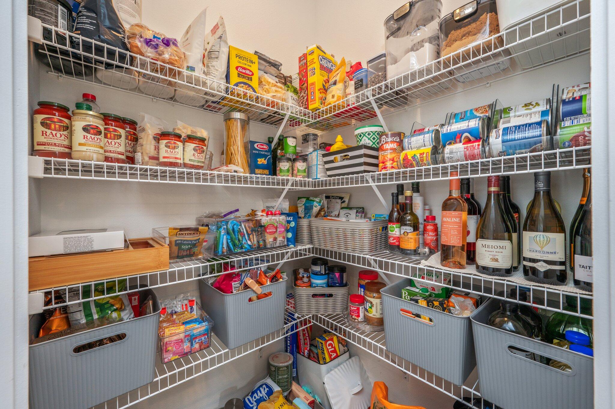 134 Blooming Cove Crestview, FL 32539 - Photo 16 of 50 a store room with lots of clutter and refrigerator
