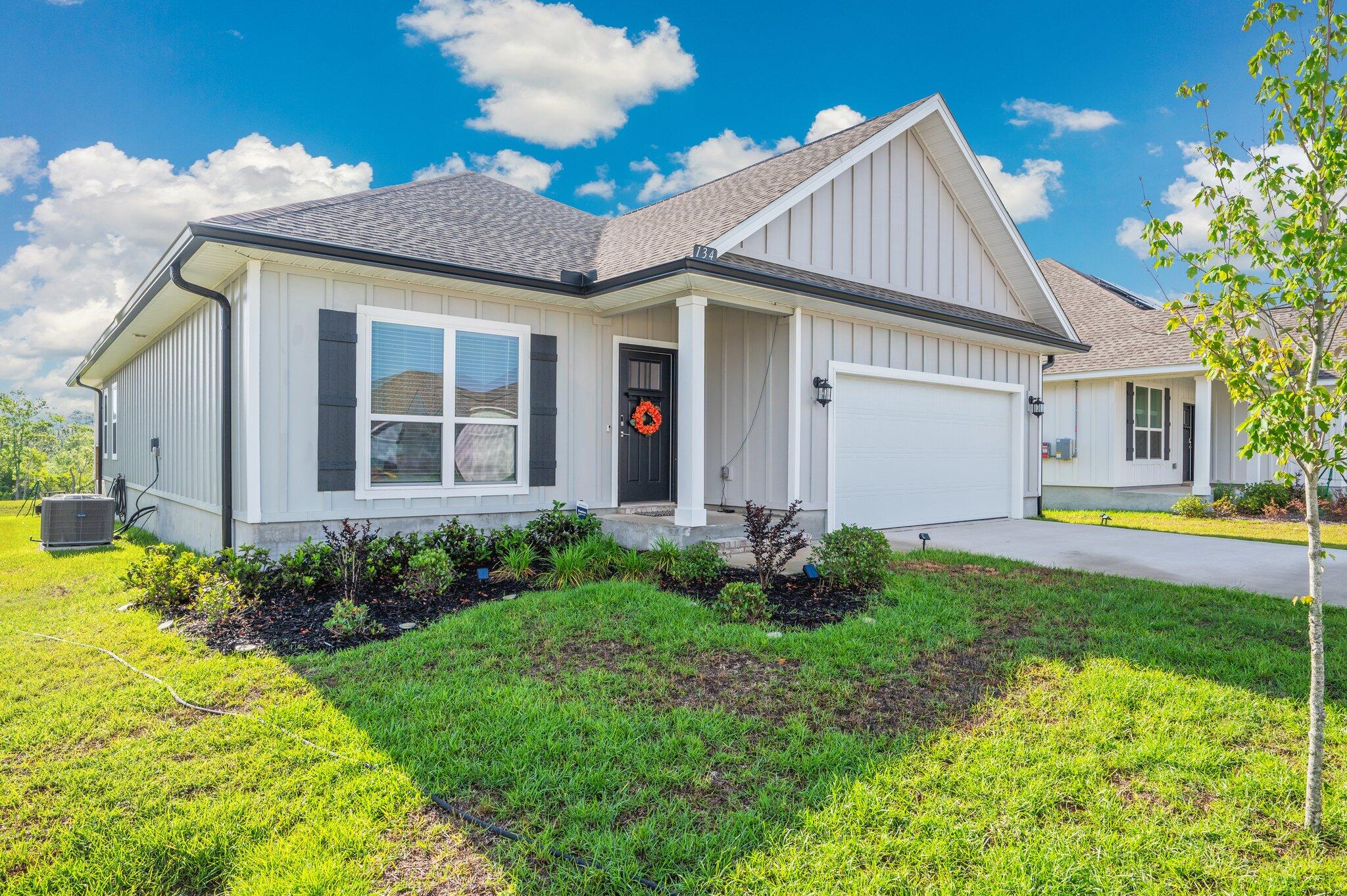 134 Blooming Cove Crestview, FL 32539 - Photo 2 of 50 a view of a house with backyard and garden