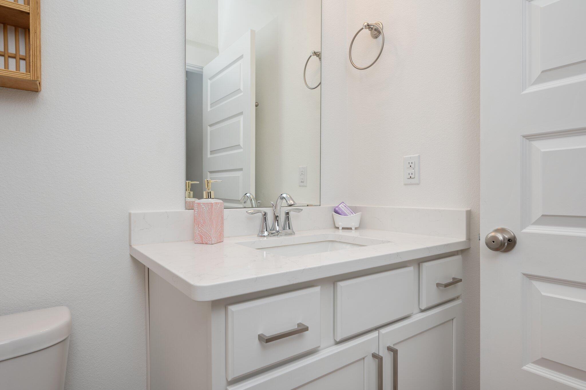 134 Blooming Cove Crestview, FL 32539 - Photo 21 of 50 a bathroom with a granite countertop sink and a toilet