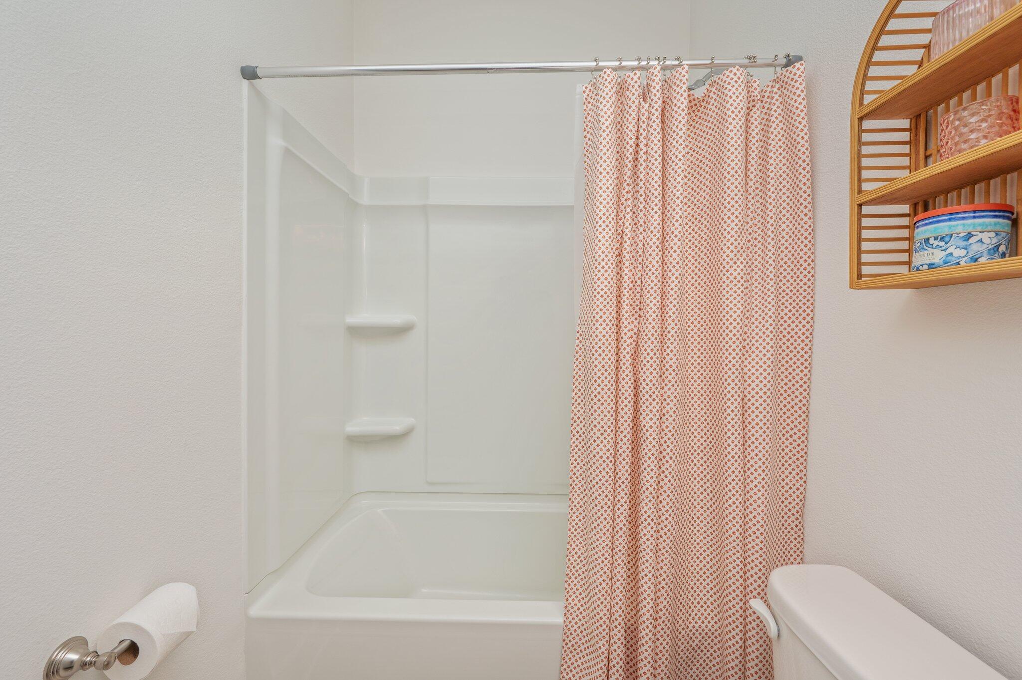 134 Blooming Cove Crestview, FL 32539 - Photo 22 of 50 a bathroom with a shower curtain and a bathtub