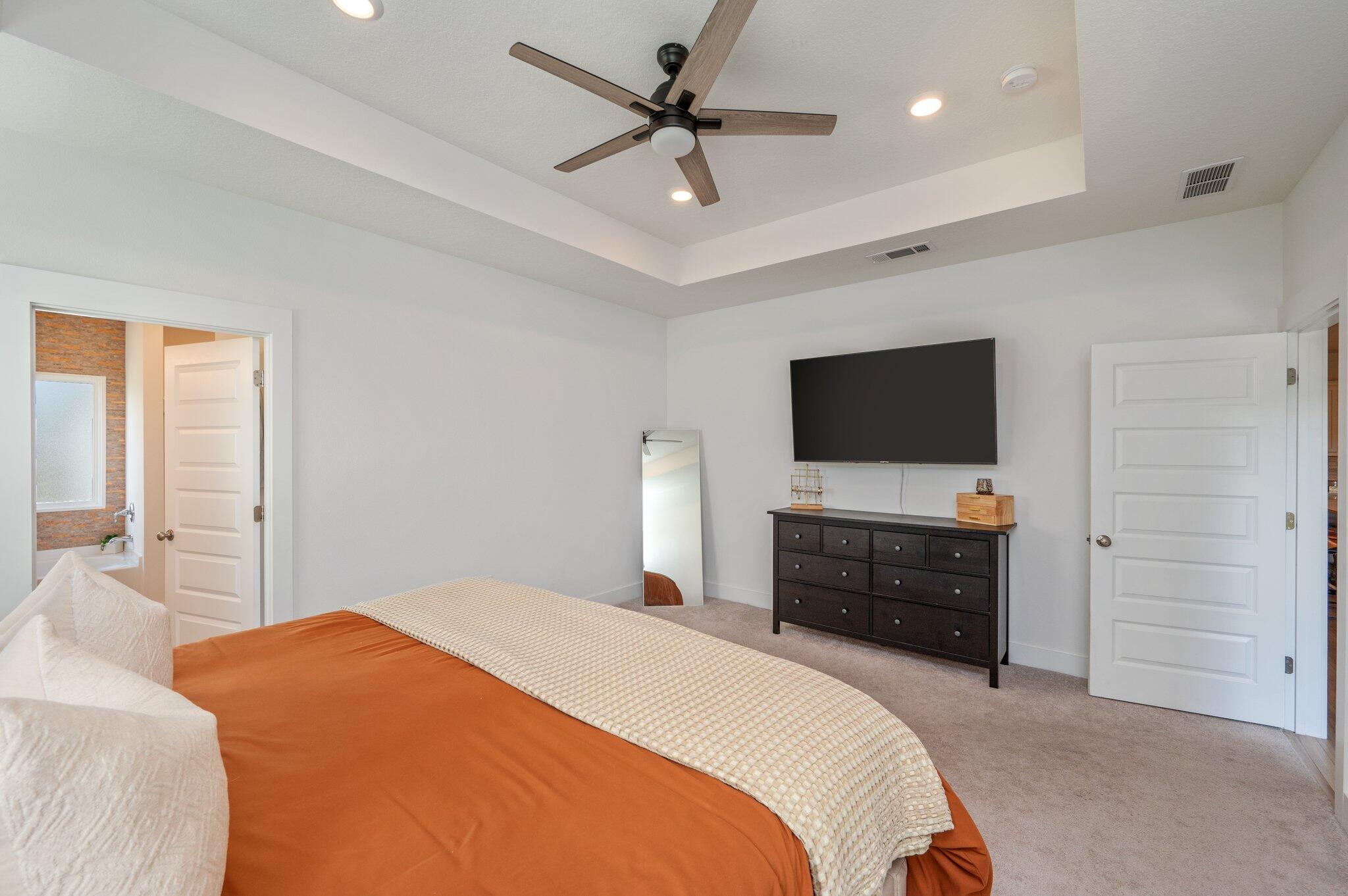 134 Blooming Cove Crestview, FL 32539 - Photo 24 of 50 a bedroom with a bed and a flat screen tv
