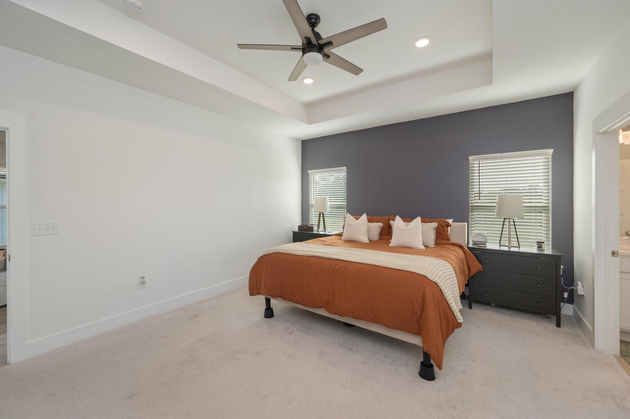 134 Blooming Cove Crestview, FL 32539 - Photo 25 of 50 a spacious bedroom with a bed and a chandelier