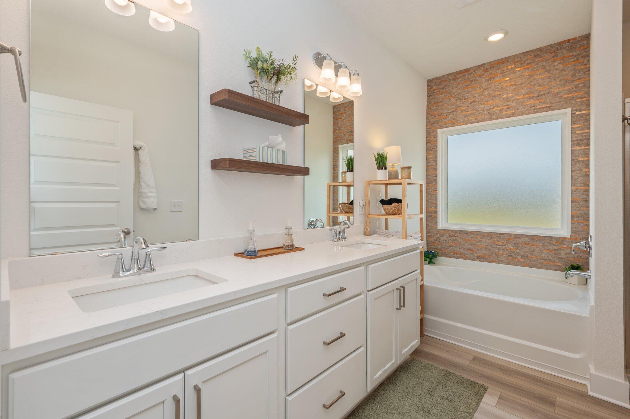 134 Blooming Cove Crestview, FL 32539 - Photo 26 of 50 a bathroom with a tub sink and mirror